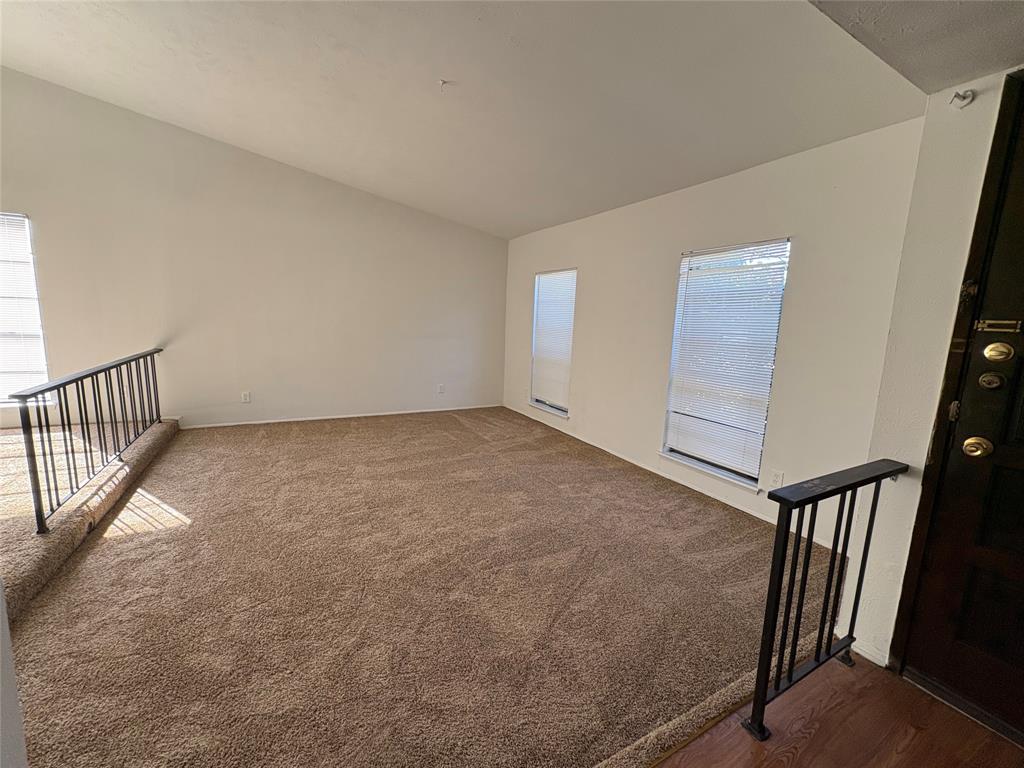 7226 Little Canyon Road Dallas, TX 75249 - Photo 3 of 30 a view of an empty room with stairs