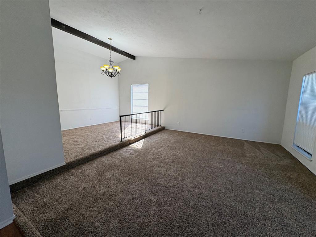 7226 Little Canyon Road Dallas, TX 75249 - Photo 4 of 30 an empty room with windows