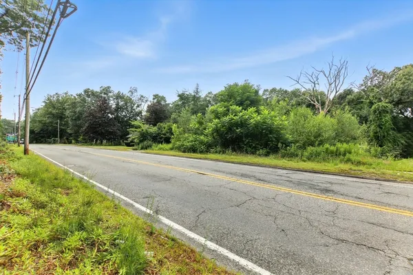 a view of a road with a yard