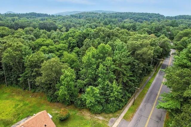 a view of a garden with a building