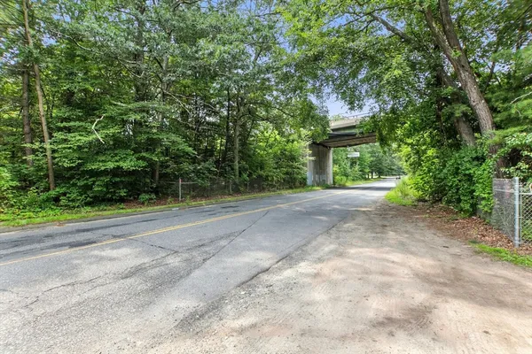 a view of a house with a street