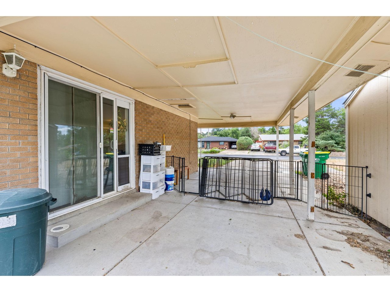 4653 Dover Street Wheat Ridge, CO 80033 - Photo 6 of 20 The black fence has been removed from the tandem carport