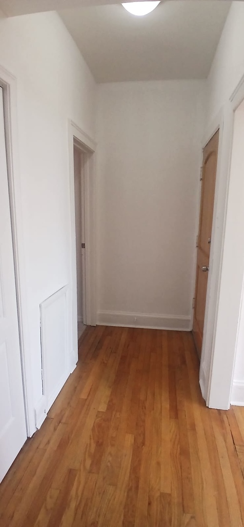 4808 West Barry Avenue, Unit 2W Chicago, IL 60641 - Photo 9 of 11 a view of an empty room