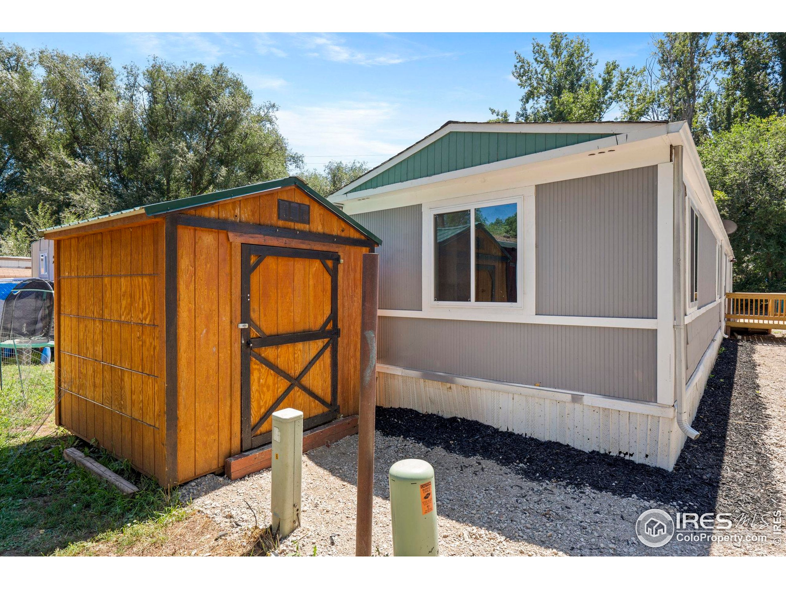 400 South Overland Trail, Unit 6 Fort Collins, CO 80521 - Photo 21 of 21 a front view of a house with garden