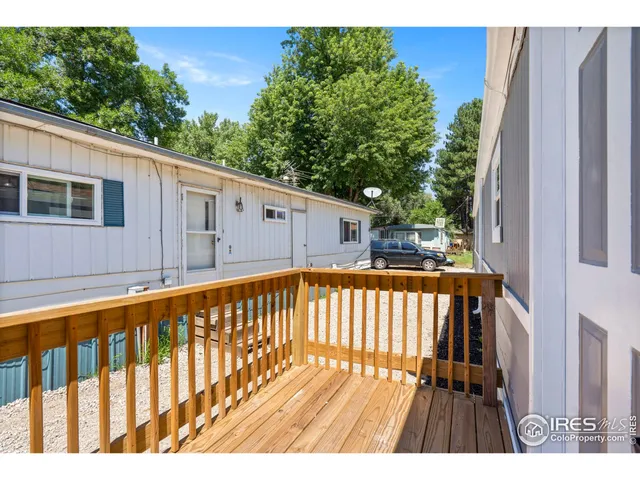 a view of deck with a large swimming pool