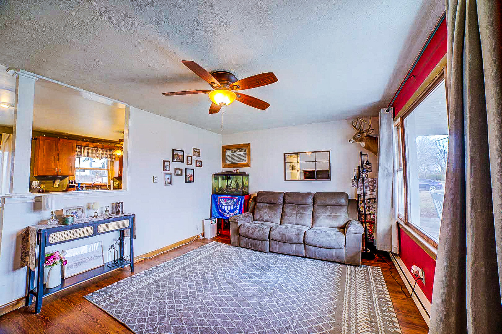 708 Sycamore Street Watseka, IL 60970 - Photo 12 of 25 a living room with furniture and a flat screen tv