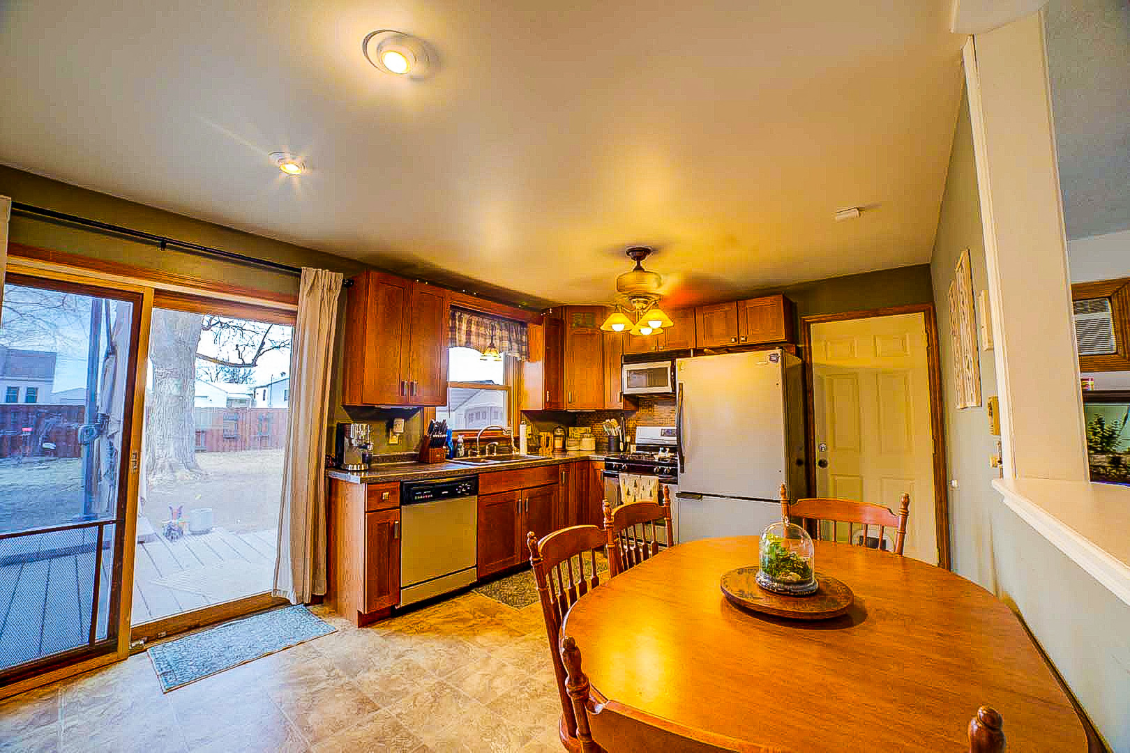 708 Sycamore Street Watseka, IL 60970 - Photo 13 of 25 a view of a dining room with furniture window and outside view
