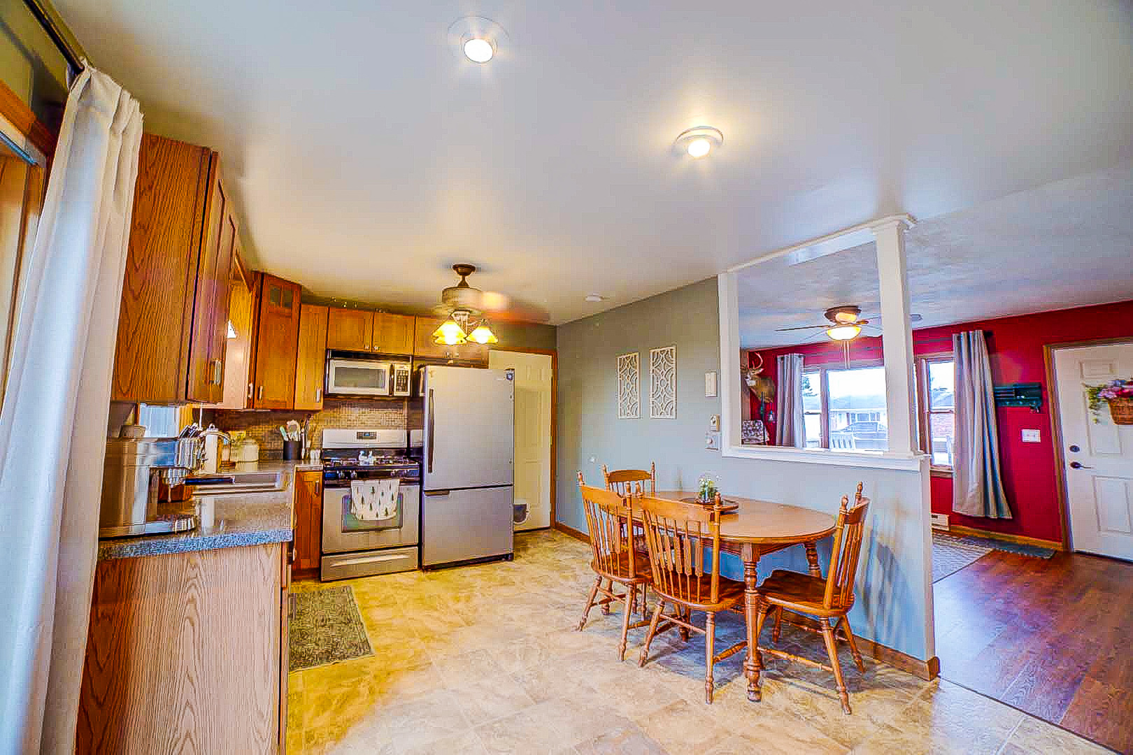 708 Sycamore Street Watseka, IL 60970 - Photo 14 of 25 a view of a dining room with furniture and wooden floor