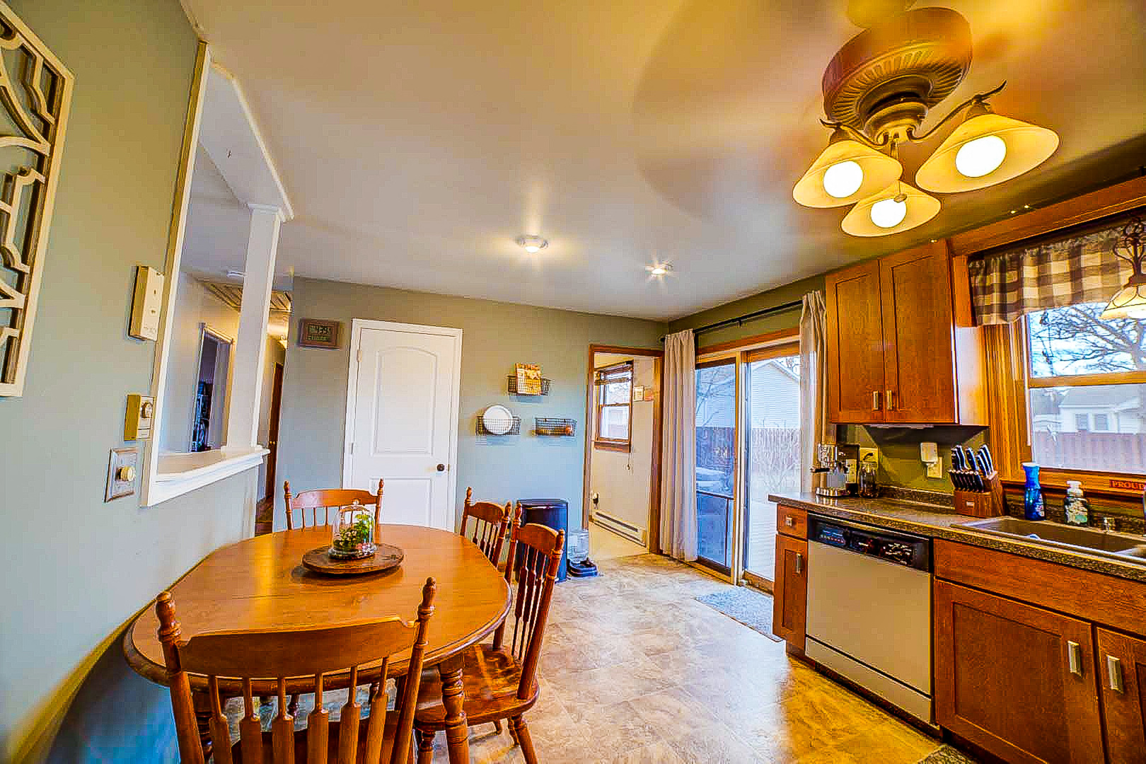 708 Sycamore Street Watseka, IL 60970 - Photo 15 of 25 a large kitchen with a table and chairs