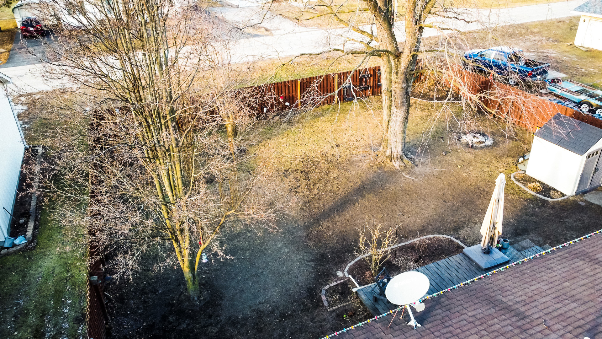 708 Sycamore Street Watseka, IL 60970 - Photo 8 of 25 a backyard of a house with table and chairs