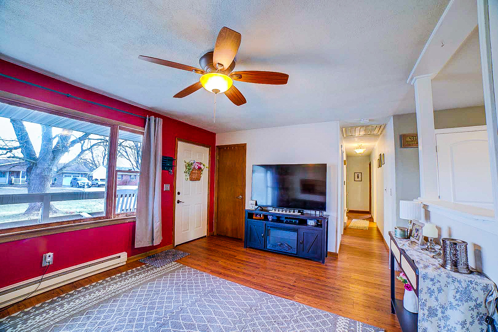 708 Sycamore Street Watseka, IL 60970 - Photo 10 of 25 a living room with furniture and a flat screen tv