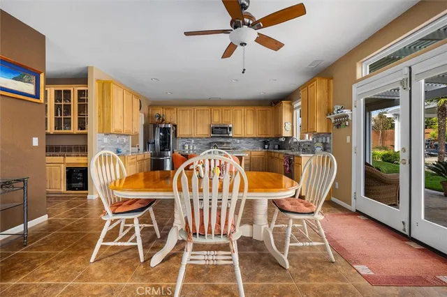 a large kitchen with granite countertop lots of counter space and windows