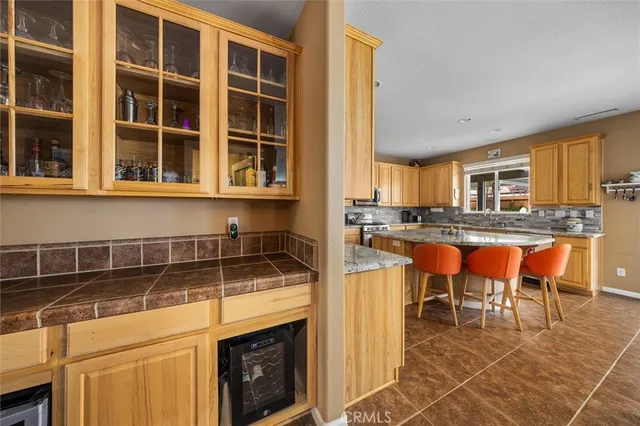 a kitchen with a stove a sink and a microwave