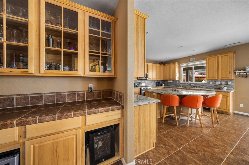 795 Angus Street Paso Robles, CA 93446 - Photo 17 of 75 a kitchen with a table chairs and a sink