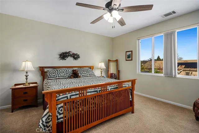 a view of walk in closet with clothes