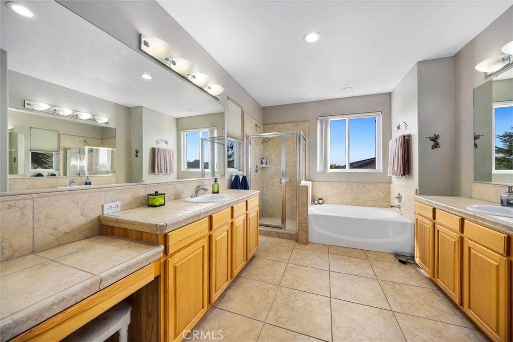 795 Angus Street Paso Robles, CA 93446 - Photo 27 of 75 a large kitchen with a large counter top and stainless steel appliances