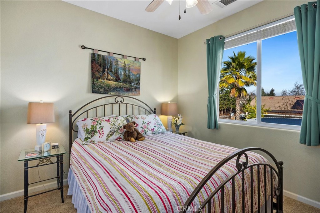 795 Angus Street Paso Robles, CA 93446 - Photo 32 of 75 a bedroom with a bed and a painting on the wall