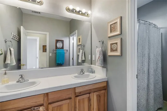 a view of a swimming pool with a patio and a garden