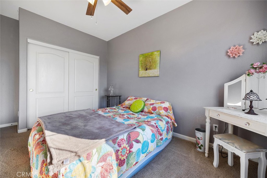 795 Angus Street Paso Robles, CA 93446 - Photo 39 of 75 a bedroom that has a bed and a table in it