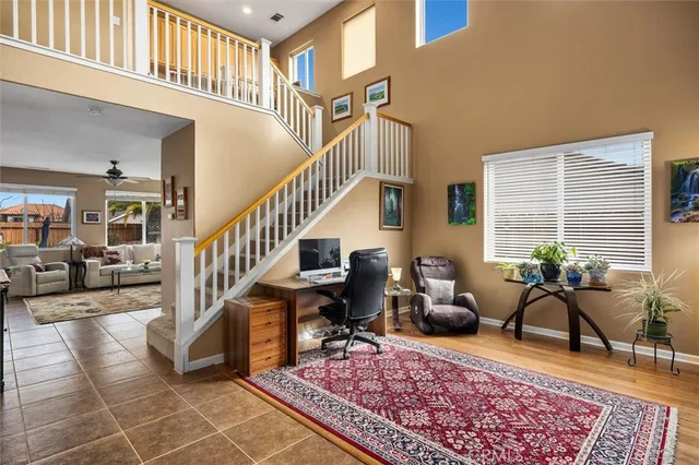 a dining room with furniture and a chandelier