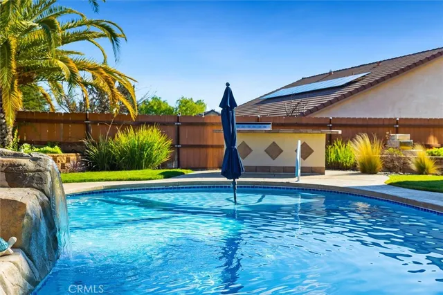 a view of a swimming pool with a patio