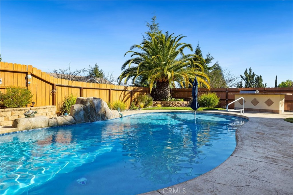 795 Angus Street Paso Robles, CA 93446 - Photo 46 of 75 a view of a swimming pool with a lawn chairs