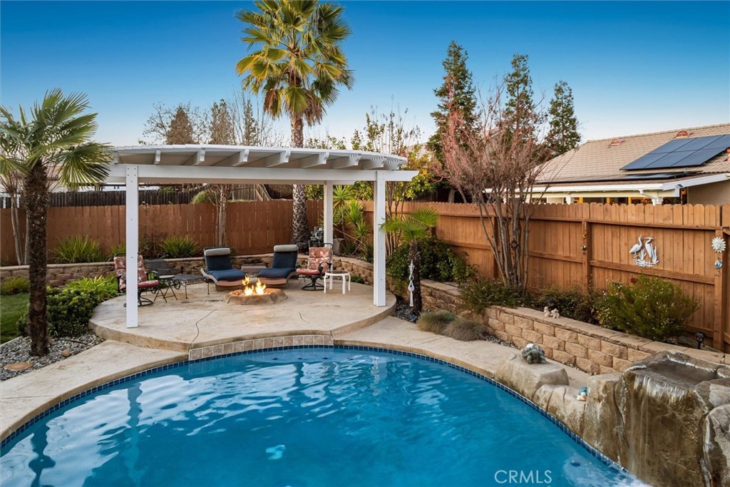 795 Angus Street Paso Robles, CA 93446 - Photo 49 of 75 a view of a swimming pool with a patio and a garden