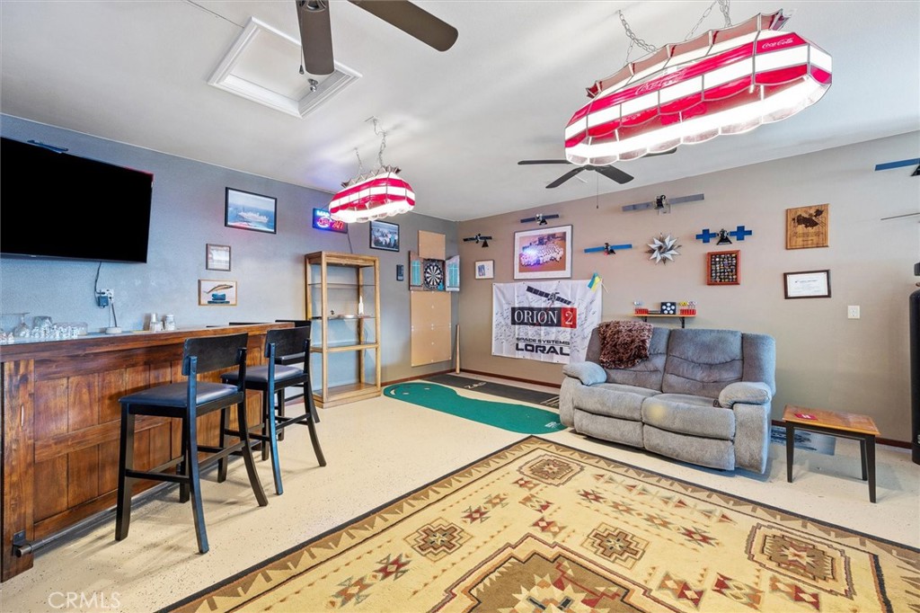 795 Angus Street Paso Robles, CA 93446 - Photo 54 of 75 a living room with furniture and a flat screen tv