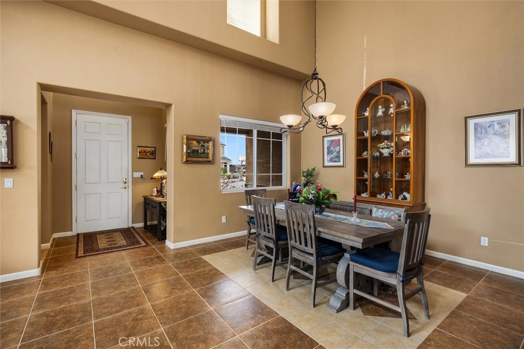 795 Angus Street Paso Robles, CA 93446 - Photo 6 of 75 a view of a dining room with furniture and chandelier