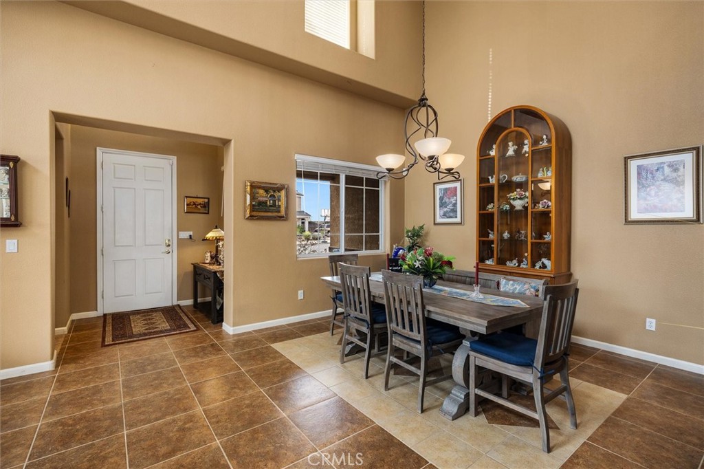 795 Angus Street Paso Robles, CA 93446 - Photo 6 of 75 a view of a dining room with furniture and chandelier