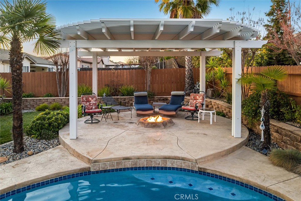 795 Angus Street Paso Robles, CA 93446 - Photo 61 of 75 a view of a patio with table and chairs potted plants with wooden floor