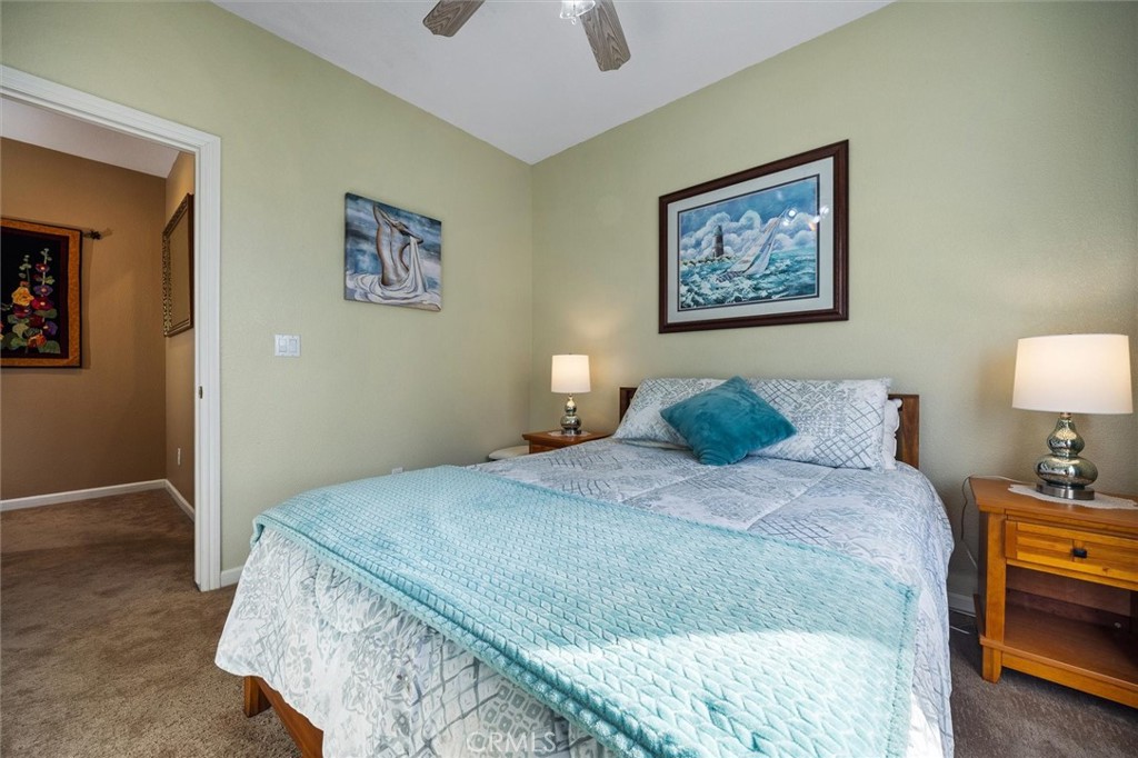 795 Angus Street Paso Robles, CA 93446 - Photo 9 of 75 a bedroom with bed and paintings on the wall