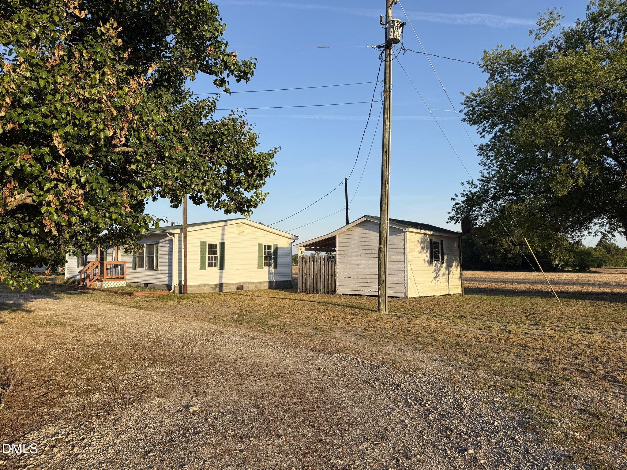 173 Lewis Iley Tew Road Dunn, NC 28334 - Photo 2 of 17 Front with outbuilding view