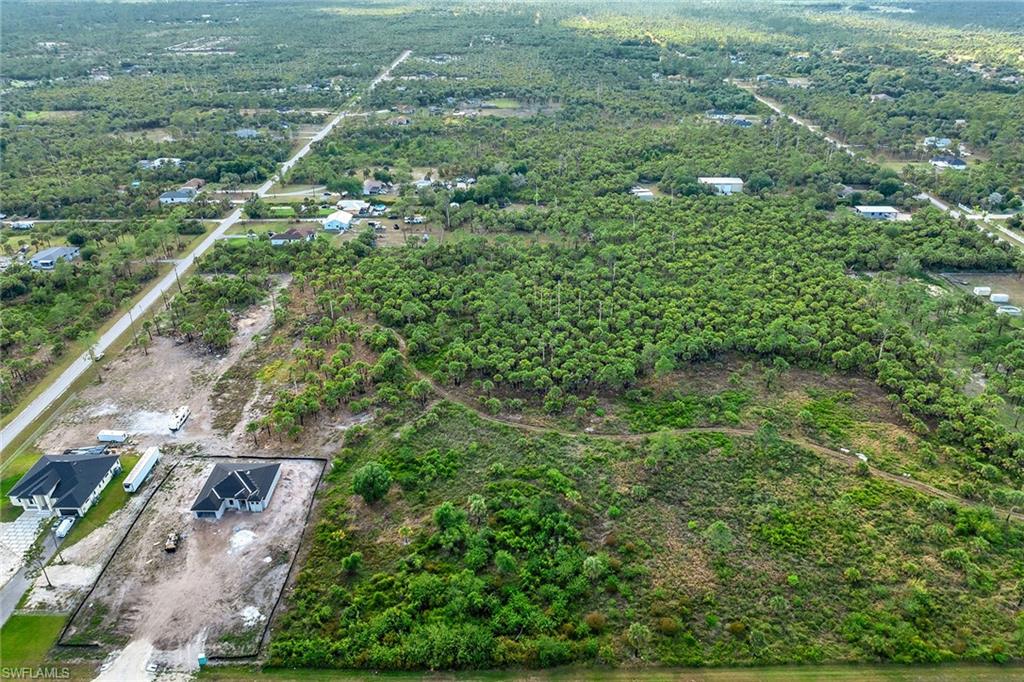Everglades Boulevard South Naples, FL 34117 - Photo 3 of 13 an aerial view of residential houses with outdoor space and trees