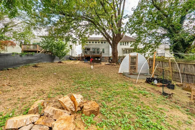 a balcony with wooden floor and fence