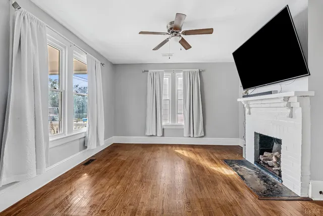 a view of livingroom with furniture flat screen tv and wooden floor