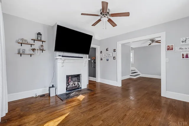 a view of livingroom with furniture flat screen tv and fireplace