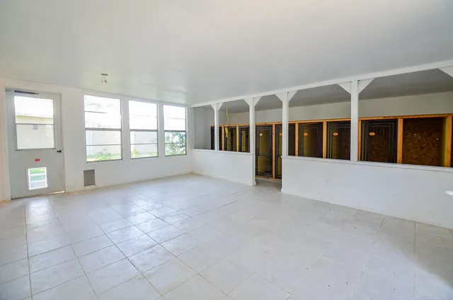 an empty room with windows