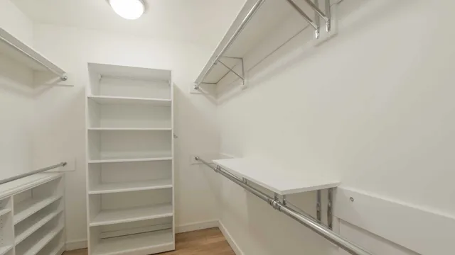 a view of an empty walk in closet