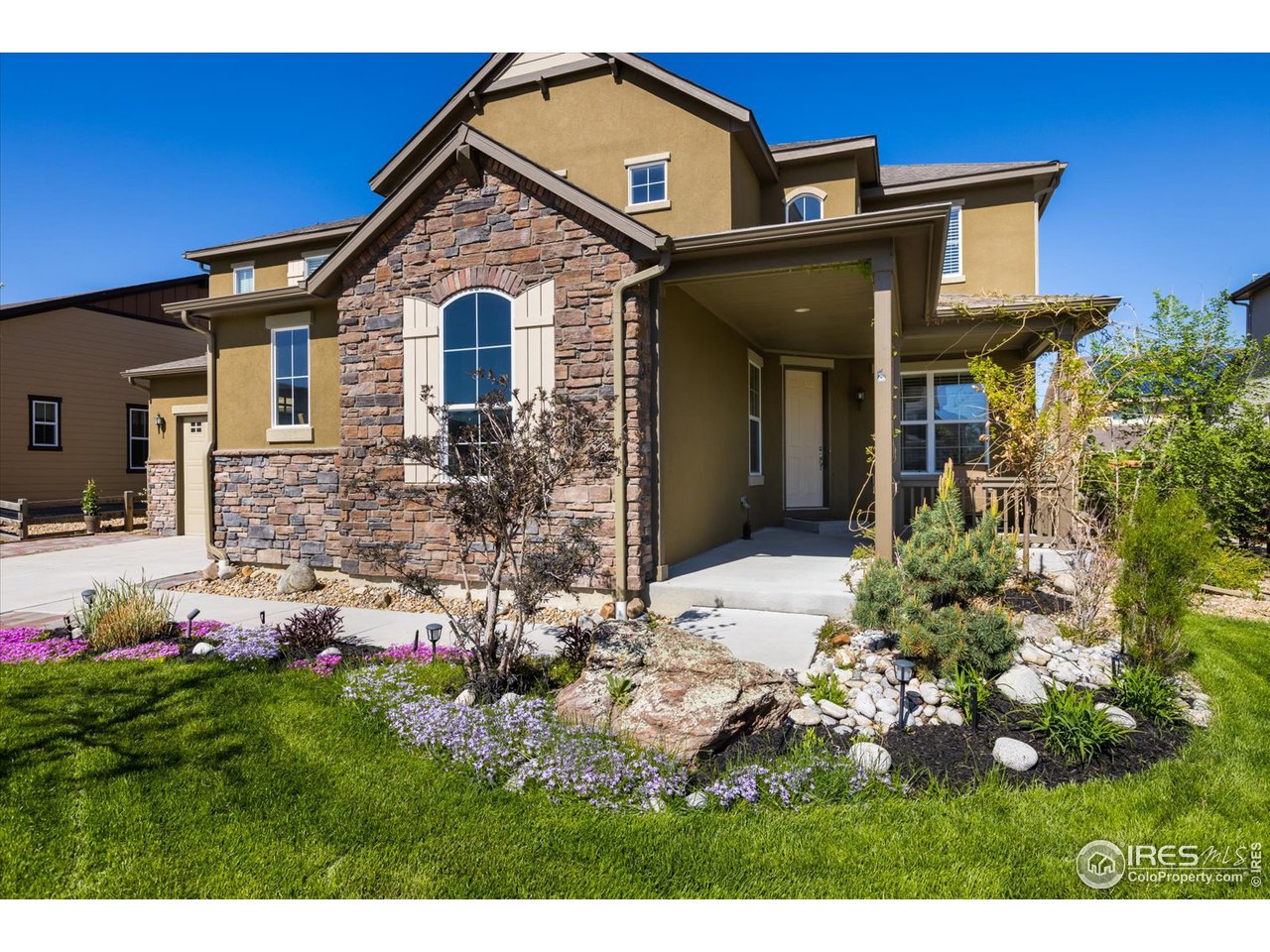 2270 Front Range Road Erie, CO 80516 - Photo 3 of 12 Inviting Front Porch w/ GORGEOUS Professional Landscaping