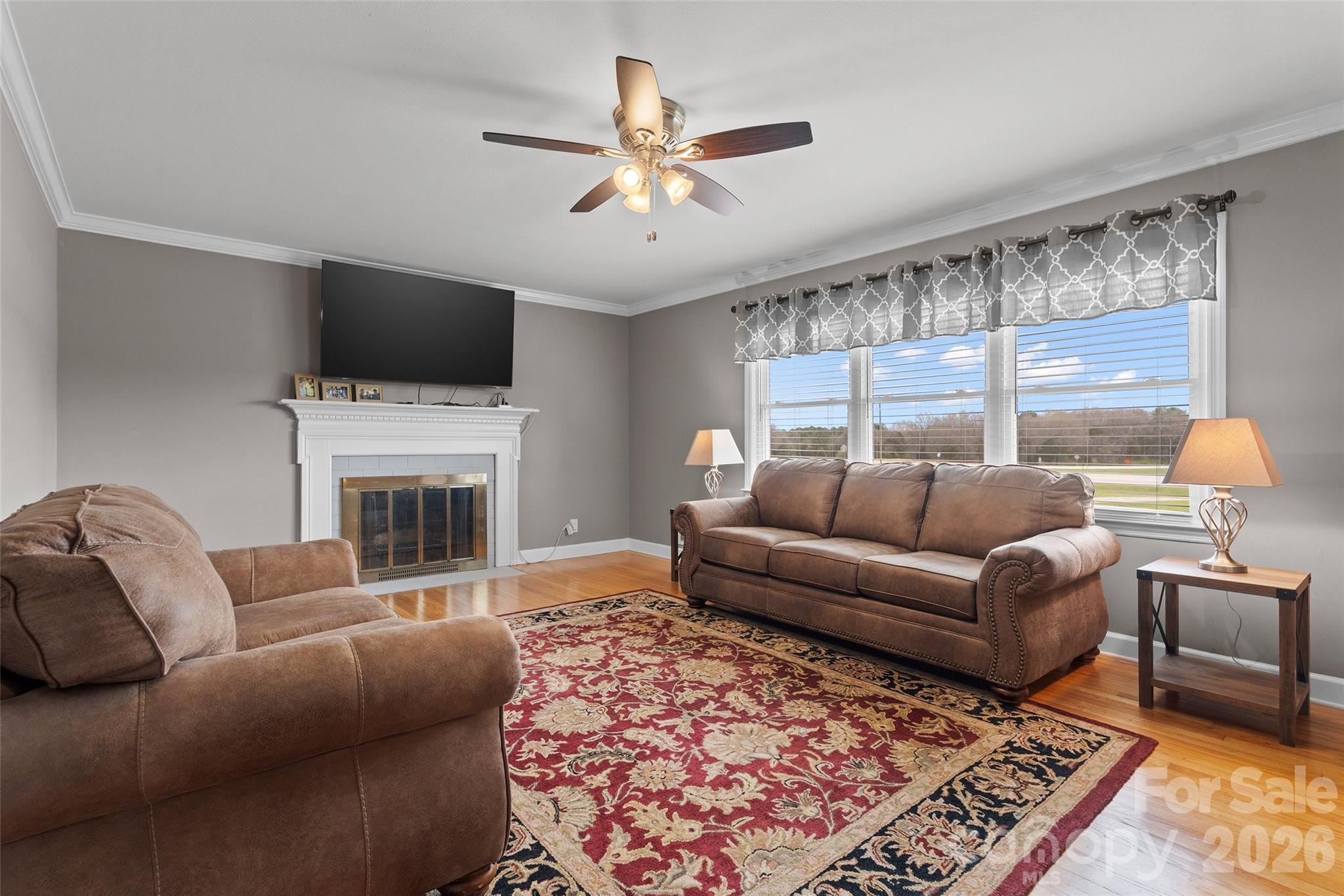 871 Saluda Road Chester, SC 29706 - Photo 6 of 46 a living room with furniture a flat screen tv and a fireplace