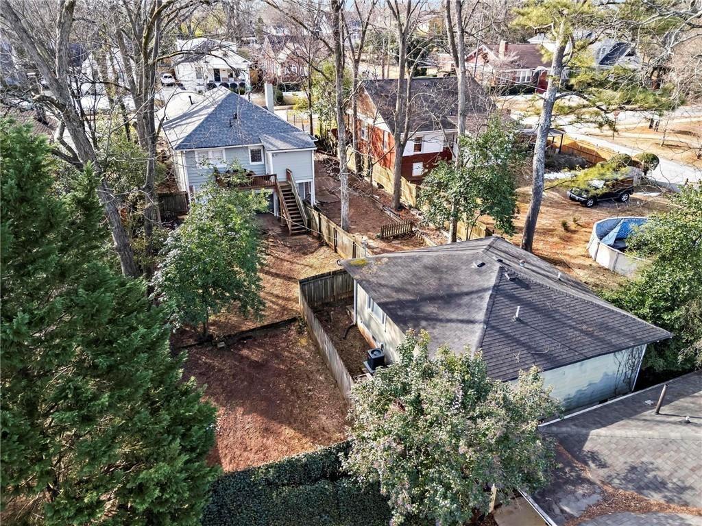 2070 Ridgedale Road Northeast Atlanta, GA 30317 - Photo 16 of 18 a aerial view of a house with table and chairs under an umbrella