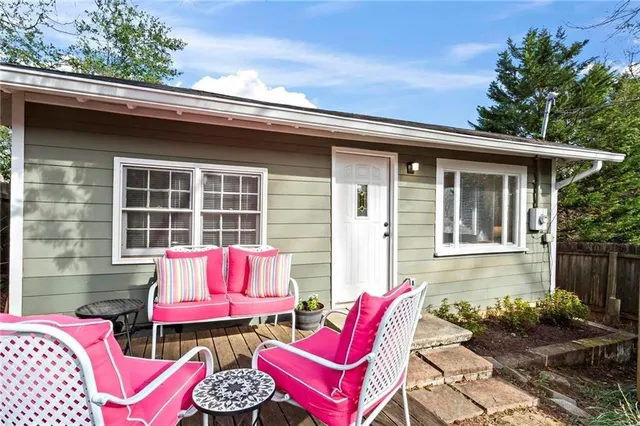 a view of a chair and tables in the patio