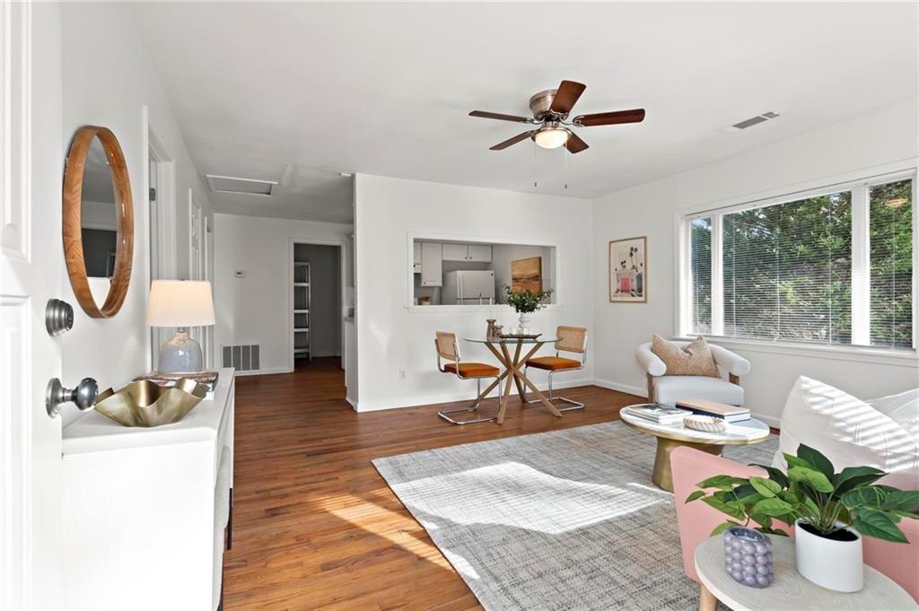 2070 Ridgedale Road Northeast Atlanta, GA 30317 - Photo 3 of 18 a living room with furniture and a wooden floor