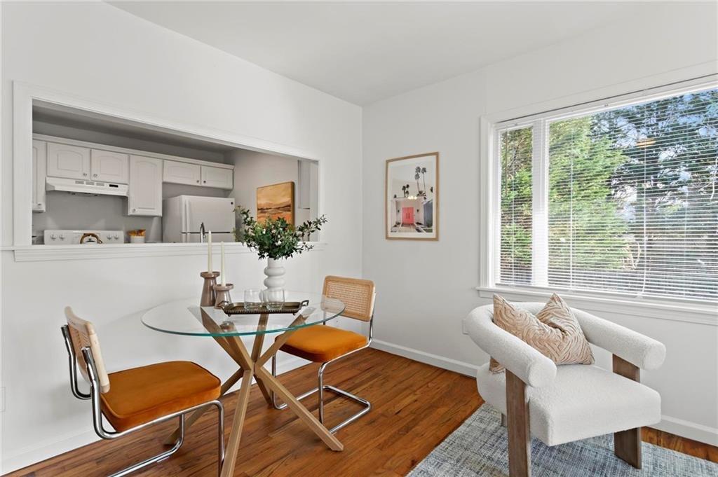 2070 Ridgedale Road Northeast Atlanta, GA 30317 - Photo 6 of 18 a dining room with furniture and wooden floor