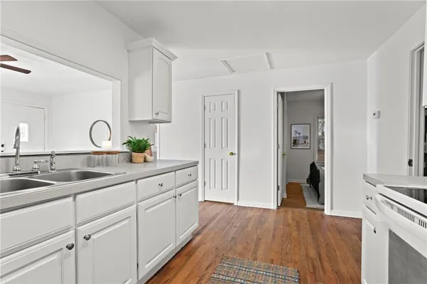 a kitchen with a sink and cabinets