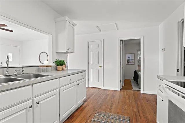 a kitchen with a sink and cabinets