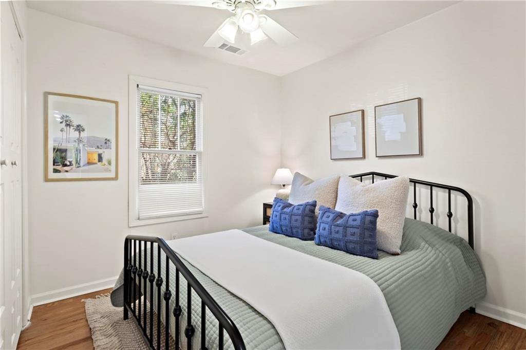 2070 Ridgedale Road Northeast Atlanta, GA 30317 - Photo 10 of 18 a bedroom with a bed and a window