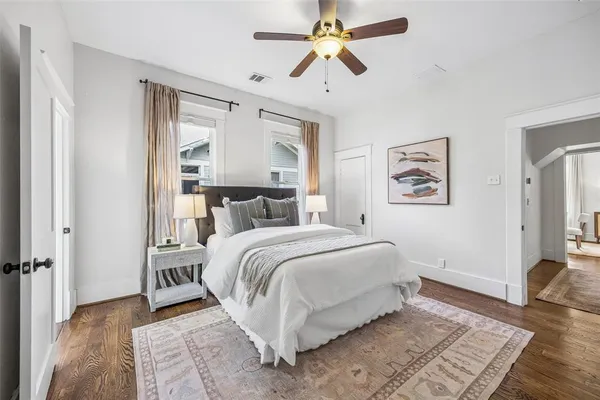 a bed room with a bed and a chandelier