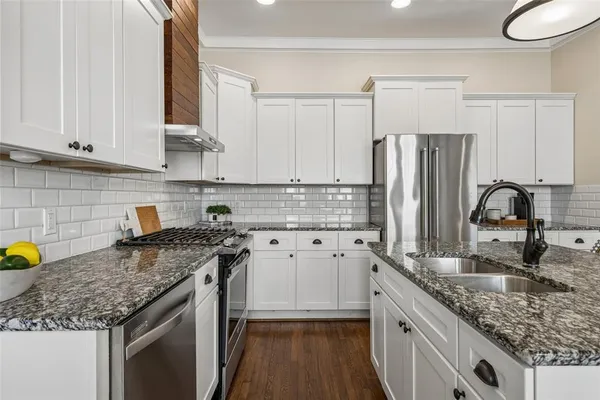 a kitchen with granite countertop lots of counter top space and dining table